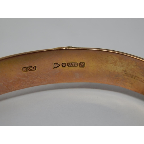 1 - 9ct Yellow Gold Hinged Bangle with Buckle Decoration: Weight 10.1g