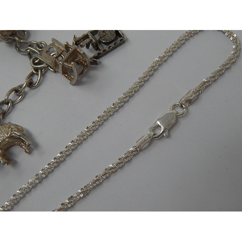 31 - Silver Charm Bracelet with Numerous Charms together with a silver bracelet & silver brooch.