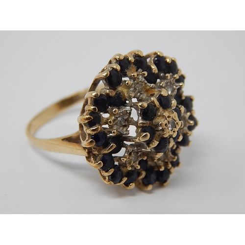 56 - 9ct Yellow Gold with Flower Head Set with Diamonds & Sapphires: Ring Size R