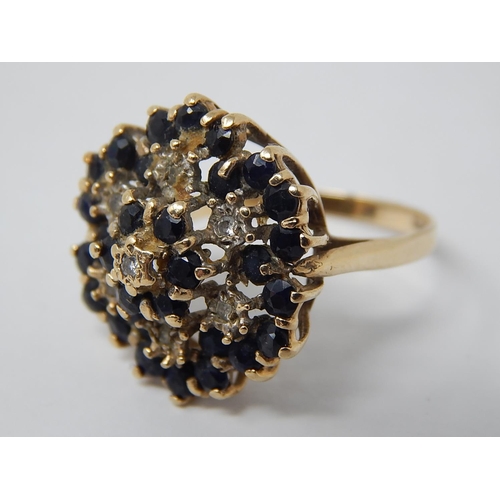 56 - 9ct Yellow Gold with Flower Head Set with Diamonds & Sapphires: Ring Size R