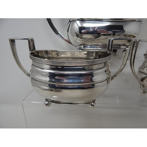 87 - HARRODS: A Georgian Pattern Silver Tea Service Comprising Teapot, Sugar Bowl & Milk Jug: Hallmarked ... 