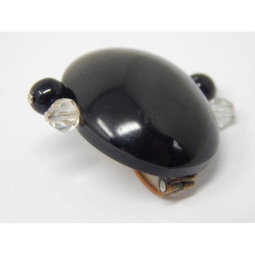 91 - Art Deco Black Oval Brooch Mounted with Faceted Clear & Black Stones to Each Side.