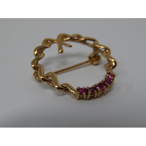 96 - Ruby Set Wreath Form Brooch in High Carat Gold.