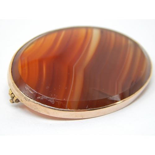 106 - Victorian Orange Banded Agate Brooch in 9ct Gold Mount.