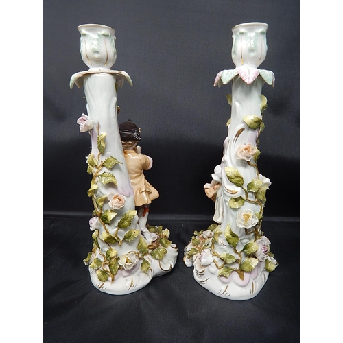 729 - Pair of Early C19th Figural Candlesticks Depicting a Boy Playing a Whistle and a Girl Dancing with E... 