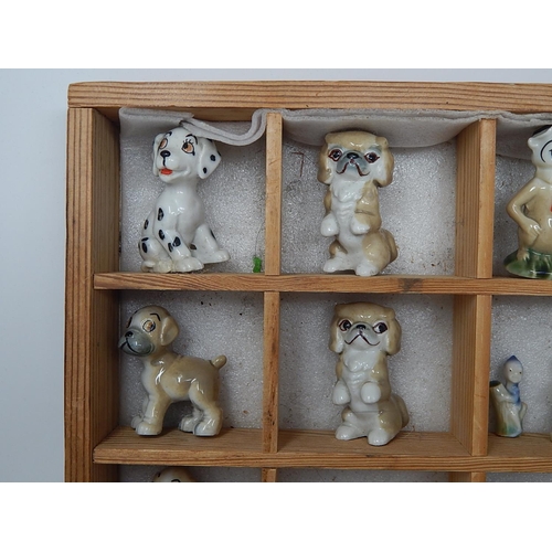 651 - Wooden Display Cabinet Containing a Quantity of Wade Figures etc (lot)