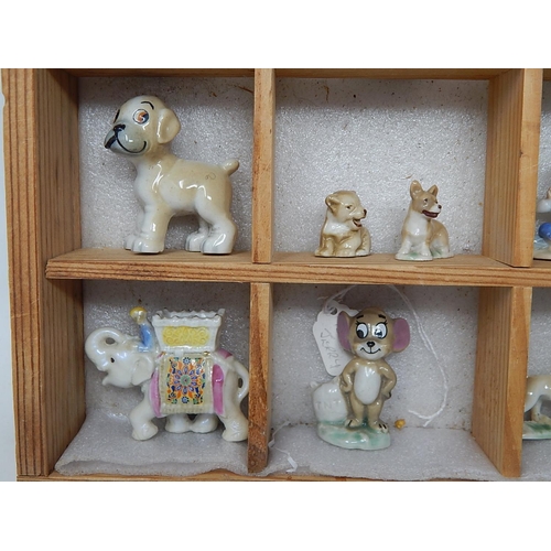 651 - Wooden Display Cabinet Containing a Quantity of Wade Figures etc (lot)