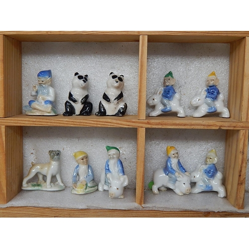 651 - Wooden Display Cabinet Containing a Quantity of Wade Figures etc (lot)