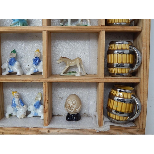 651 - Wooden Display Cabinet Containing a Quantity of Wade Figures etc (lot)