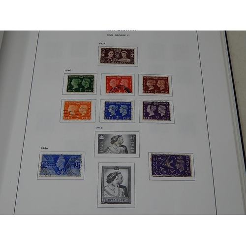 924 - Three Stanley Gibbons Stamp Albums Containing a Large Quantity of GB, Alderney, Guernsey, Jersey, Is... 