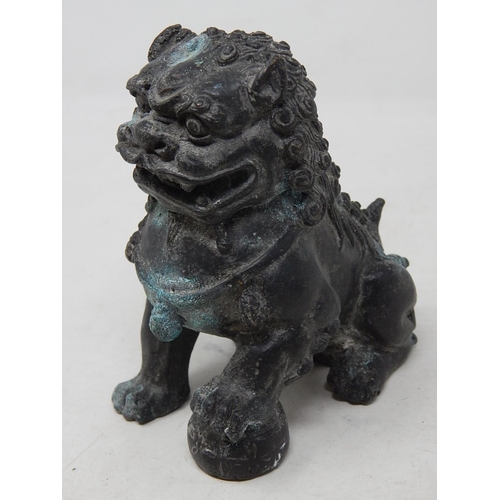 585 - Antique Chinese Bronze Temple Dog 11.5cm high together with a Bronze Four Faces of Buddha 7cm high. ... 