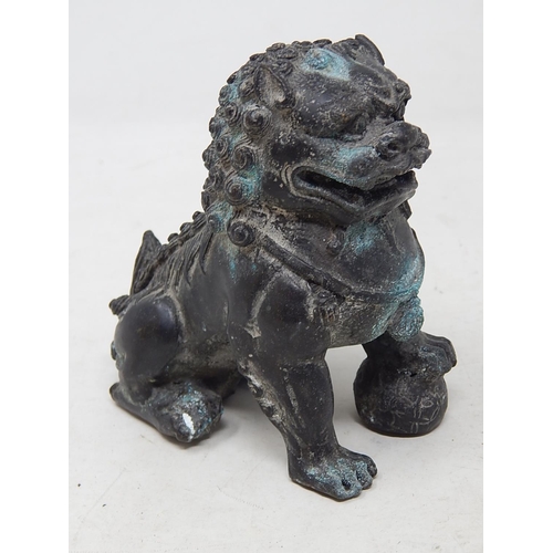 585 - Antique Chinese Bronze Temple Dog 11.5cm high together with a Bronze Four Faces of Buddha 7cm high. ... 