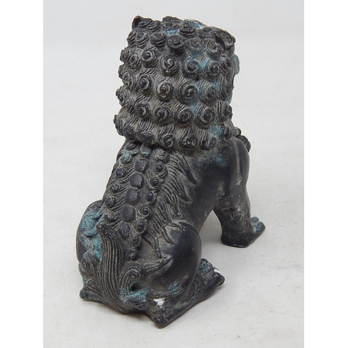 585 - Antique Chinese Bronze Temple Dog 11.5cm high together with a Bronze Four Faces of Buddha 7cm high. ... 