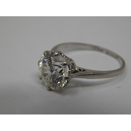 215 - An impressive diamond solitaire ring set with a single round brilliant cut diamond 3.13cts, SI1-2, I... 