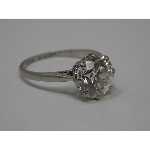 215 - An impressive diamond solitaire ring set with a single round brilliant cut diamond 3.13cts, SI1-2, I... 