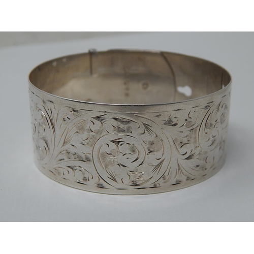 217 - Silver Wide Buckle Bangle: Hallmarked Chester 1944 by Charles Horner.