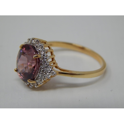 225 - 18ct Yellow Gold Ring Set with a Central Pink Zircon 4.13ct within a Diamond Border: Ring Size N: Gr... 