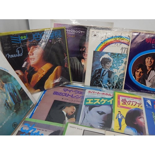 679 - A collection of 25 Japanese singles all in excellent condition and complete with lyric sheets from t... 