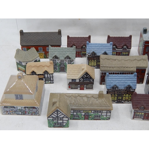 657 - Large Quantity of Wade Porcelain Houses & Shops (lot)