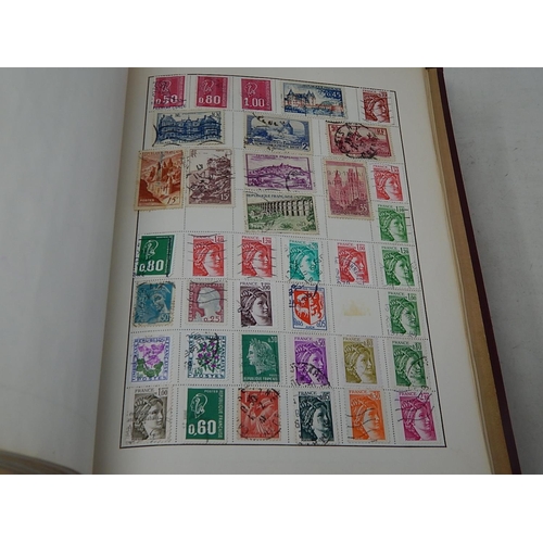 772 - Four Albums Containing a Large Quantity of World Stamps together with an Album of Russian Commemorat... 