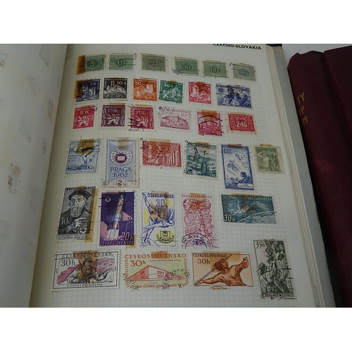 772 - Four Albums Containing a Large Quantity of World Stamps together with an Album of Russian Commemorat... 