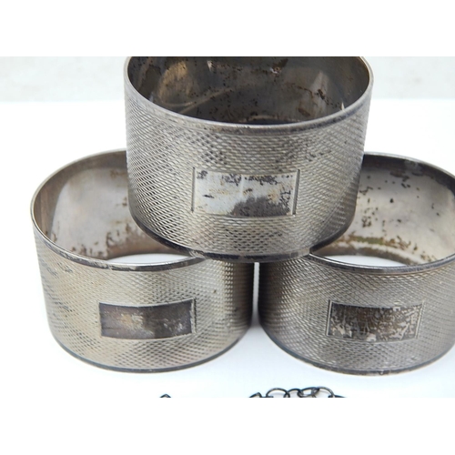 255 - 3 x Hallmarked Silver Engine Turned Napkin Rings with Blank Cartouches together with a Silver Hallma... 