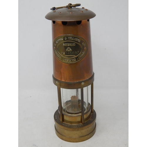 494 - E. Thomas & Williams Ltd Brass & Copper Miners Lamp: Measuring 25cm high: Complete with paperwork & ... 