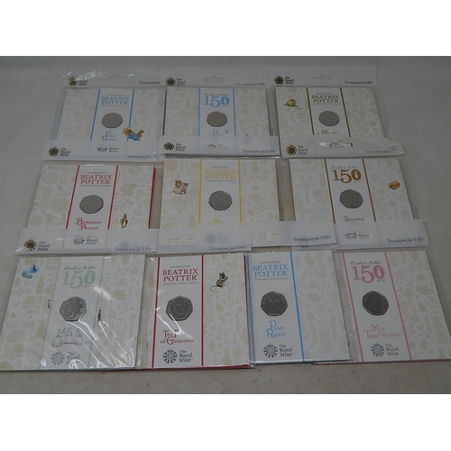 930 - Collection of 10 x Beatrix Potter 50p coins all different and about as struck housed in sealed Royal... 