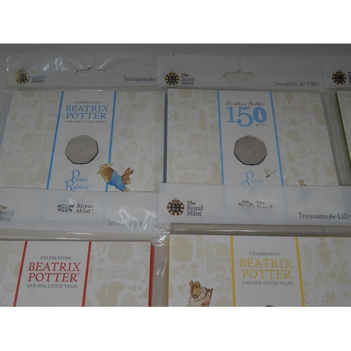 930 - Collection of 10 x Beatrix Potter 50p coins all different and about as struck housed in sealed Royal... 