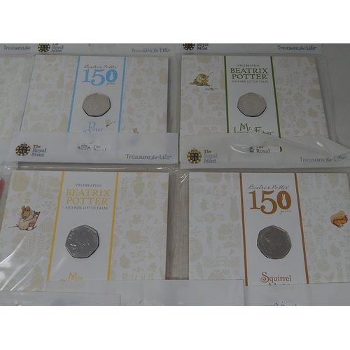 930 - Collection of 10 x Beatrix Potter 50p coins all different and about as struck housed in sealed Royal... 