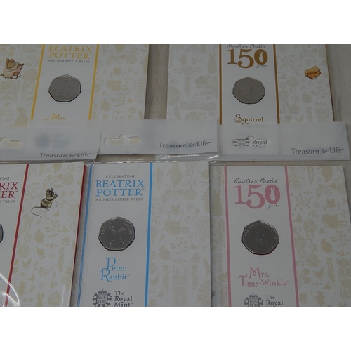 930 - Collection of 10 x Beatrix Potter 50p coins all different and about as struck housed in sealed Royal... 