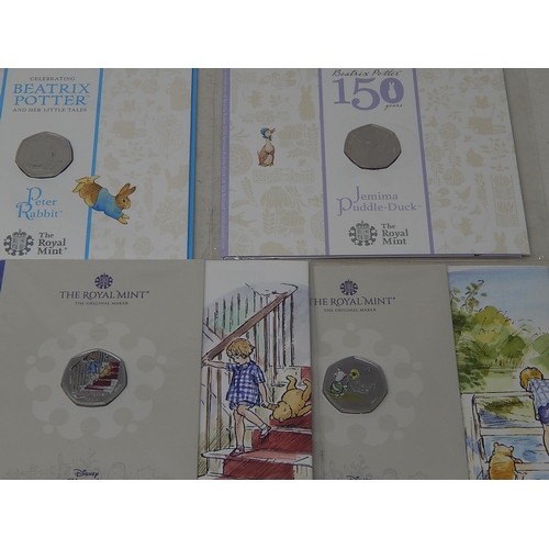 938 - Collection of 10 x 50p Commemorative Coins inc Coloured Classic Pooh, etc all Brilliant Uncirculated... 