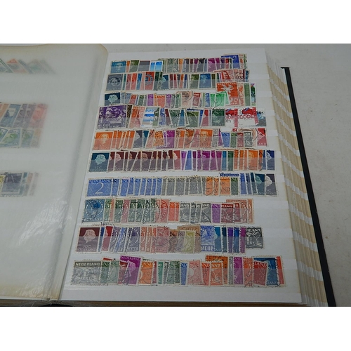 831 - An enormous collection of British Commonwealth and World stamps housed in a thick stockbook very ful... 