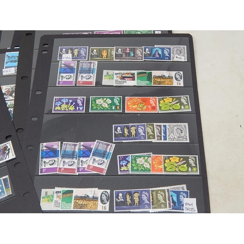 954 - A large collection of GB Pre-Decimal Mint stamps from the 1960s, many complete sets all housed on Ha... 