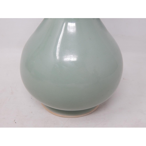 661 - Chinese Celadon Tapering Bulbous Vase with Twin Handles: The Base with Fine Yellow Rim: Measures 17.... 