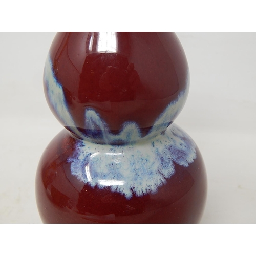 662 - Chinese Sang De Boeuf Double Gourd Vase with Blue/White Splashes of Decoration: Measures 16cm high