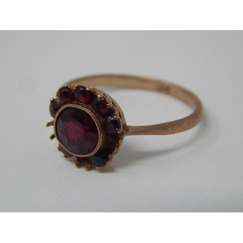 285 - 9ct Yellow Gold Garnet Set Ring: Size K: Weight 1.6g