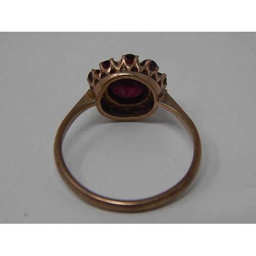 285 - 9ct Yellow Gold Garnet Set Ring: Size K: Weight 1.6g