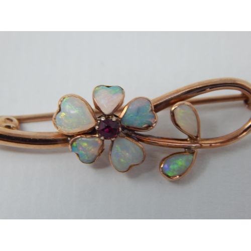5 - 9ct Yellow Gold Brooch Formed with a Flower Head Set with Opals & a Central Garnet.