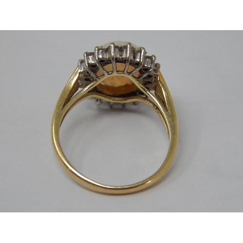 43 - 14ct Gold Ring Set with a Central Opal Estimated at 3.00cts within a Border of 18 Diamonds: Ring Siz... 