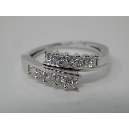 48 - Platinum Set 1.00ct Diamond Crossover Ring: The Diamonds G/H VS1: Ring Size P/Q: Platinum Weight 4.8... 