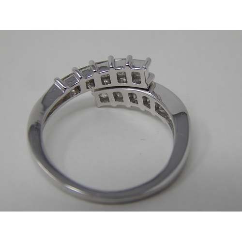 48 - Platinum Set 1.00ct Diamond Crossover Ring: The Diamonds G/H VS1: Ring Size P/Q: Platinum Weight 4.8... 