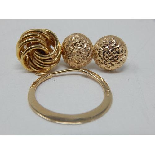 69 - A Pair of 14ct Yellow Gold Earrings together with two odd 14ct Gold earrings: Gross weight 3g