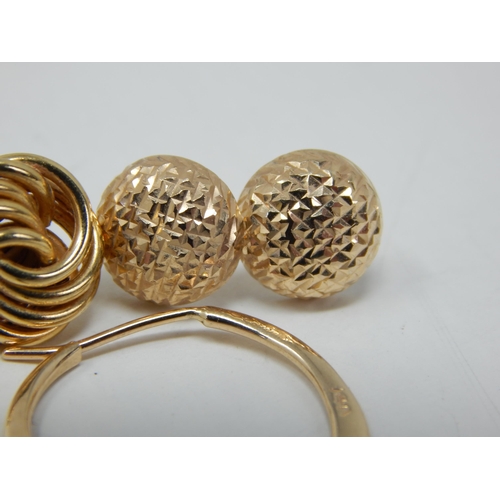 69 - A Pair of 14ct Yellow Gold Earrings together with two odd 14ct Gold earrings: Gross weight 3g