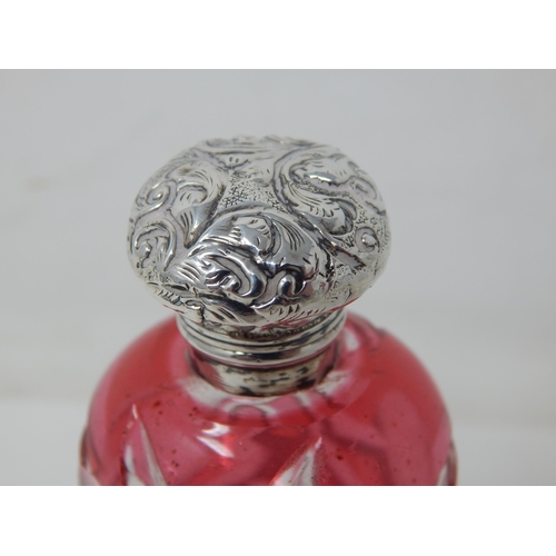 23P - Victorian Silver Topped Scent Bottle & Stopper with Cranberry Overlaid Cut Glass Body: Measuring 10c... 