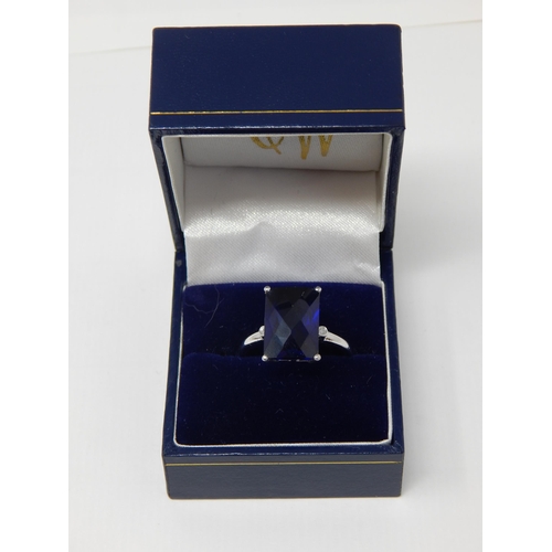 24L - 9ct White Gold Ring Set with a Diamond Either Side of a Large Faceted Blue Gem Stone in Fitted Case.... 