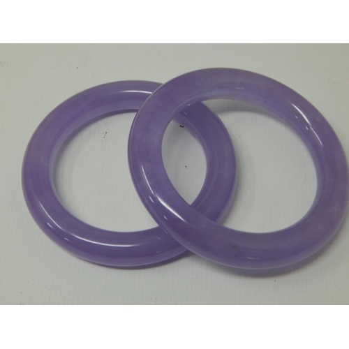 338 - Two Chinese Lilac Jade Bangles (2)