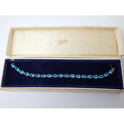 346 - 14ct Yellow Gold Gem Set Tennis Bracelet: Length 20cm in Original Harrods Case.