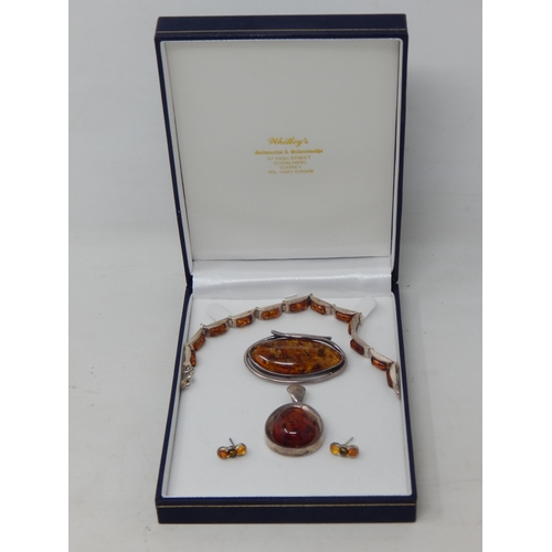 357 - Suite of Amber Set Jewellery Mounted in Silver: Comprising Bracelet, Brooch, Pendant & Earrings.