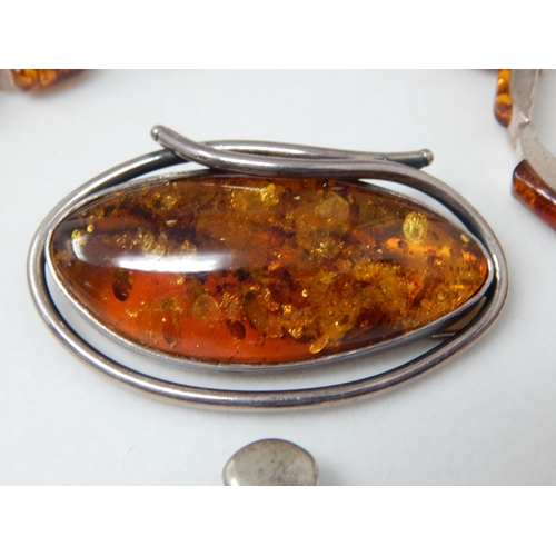 357 - Suite of Amber Set Jewellery Mounted in Silver: Comprising Bracelet, Brooch, Pendant & Earrings.